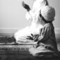 Muslim boy learning how to make Dua to Allah